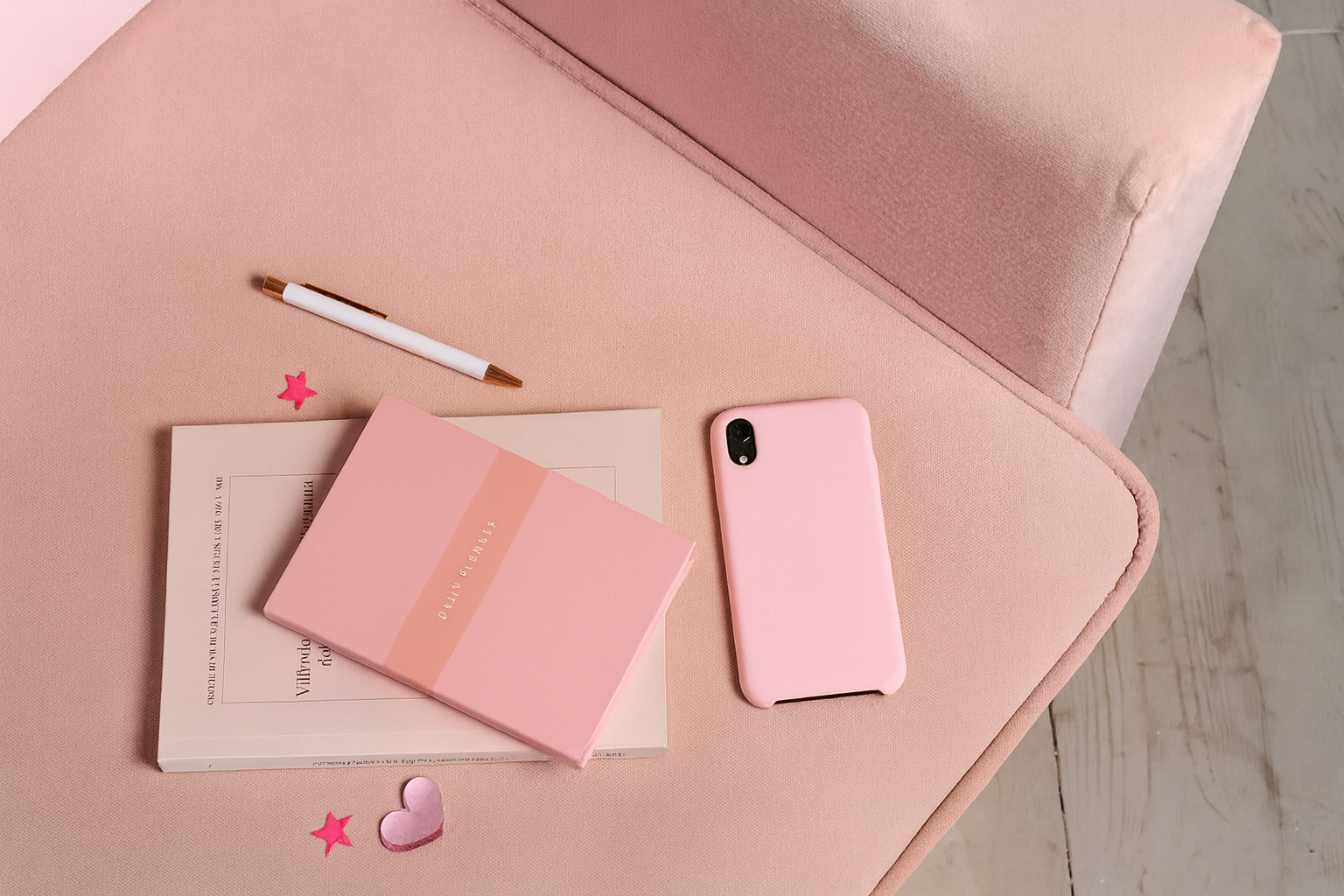 Pink Desk Setup with Notebook and Vials
