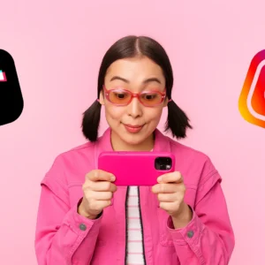 Woman Holding Phone with TikTok and Instagram Logos
